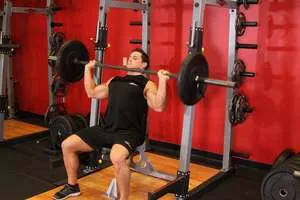 Overhead barbell press, end position